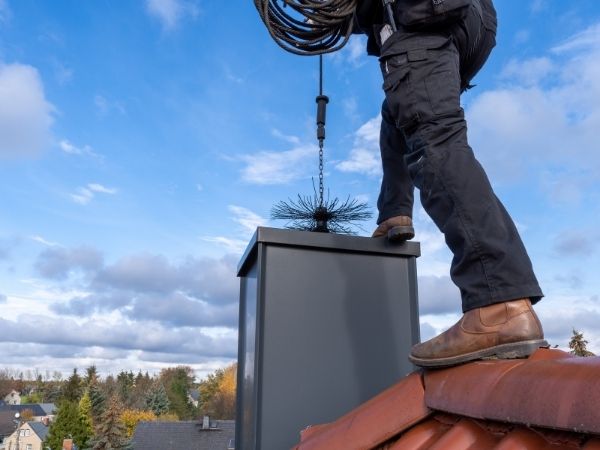 chimney-sweep-roof-teather-broom-foot