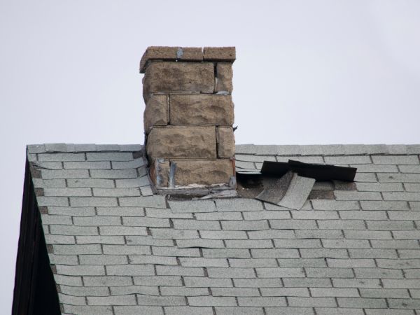 Chimney with roof damage, Brookfield, WI.