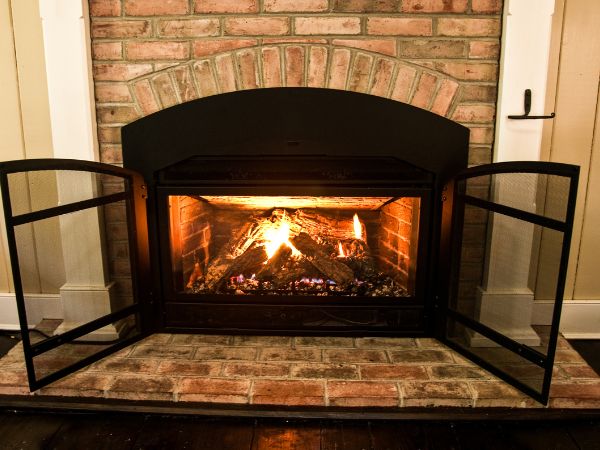 A fireplace with an open grate.